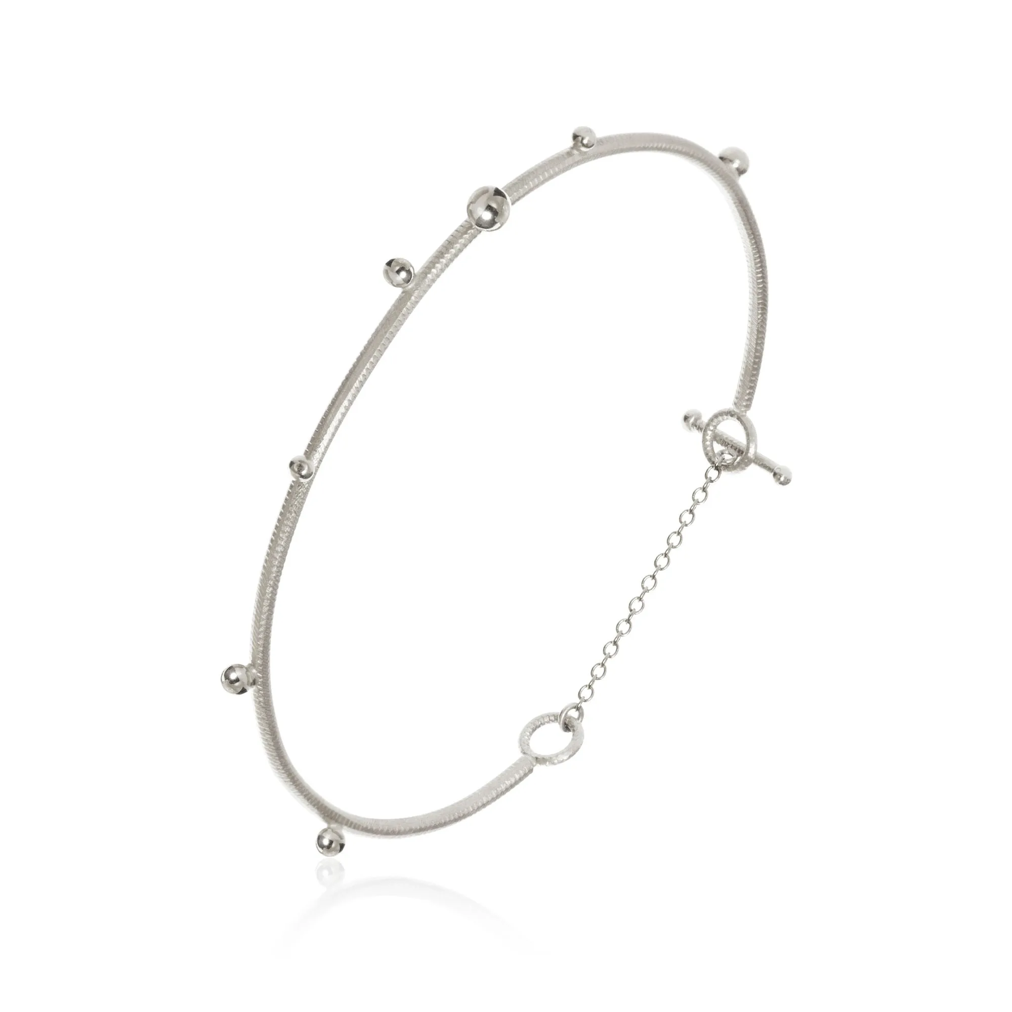 Delphis Silver Bangle